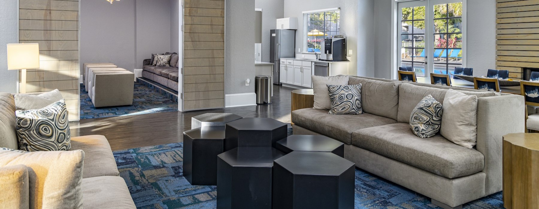 a living room with a large chandelier and a couch