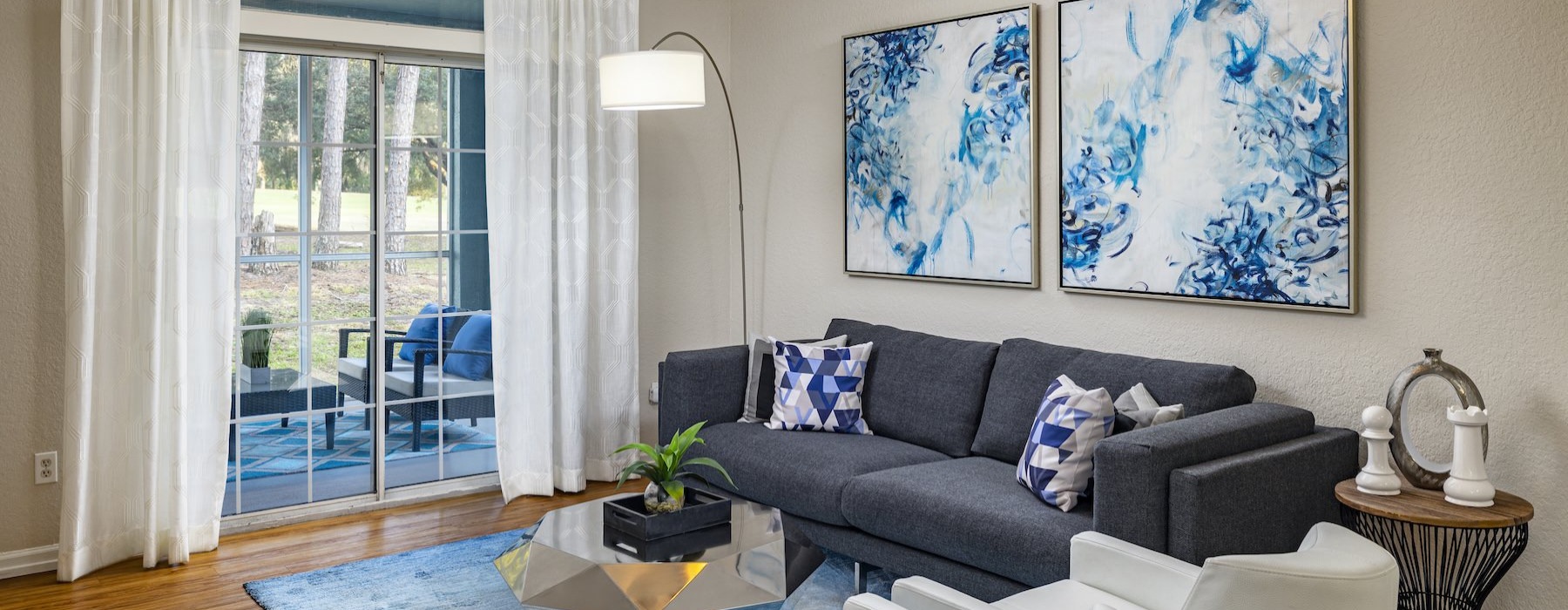 a living room with a couch and a fan